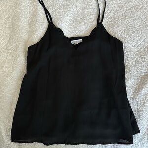 Black lined tank top with scalloped neckline & adjustable straps. Socialite.